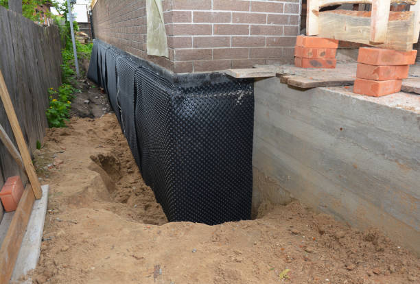 SJ Waterproofing Pros technician performing targeted Emergency Waterproofing assessment in Lake, MI